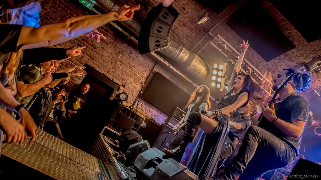 Visions of Atlantis interacting with the crowd for a good live performance 